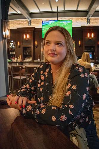 food court woman sits near wall restaurant